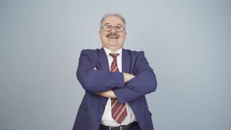 Businessman-with-arms-folded-and-laughing-at-camera.